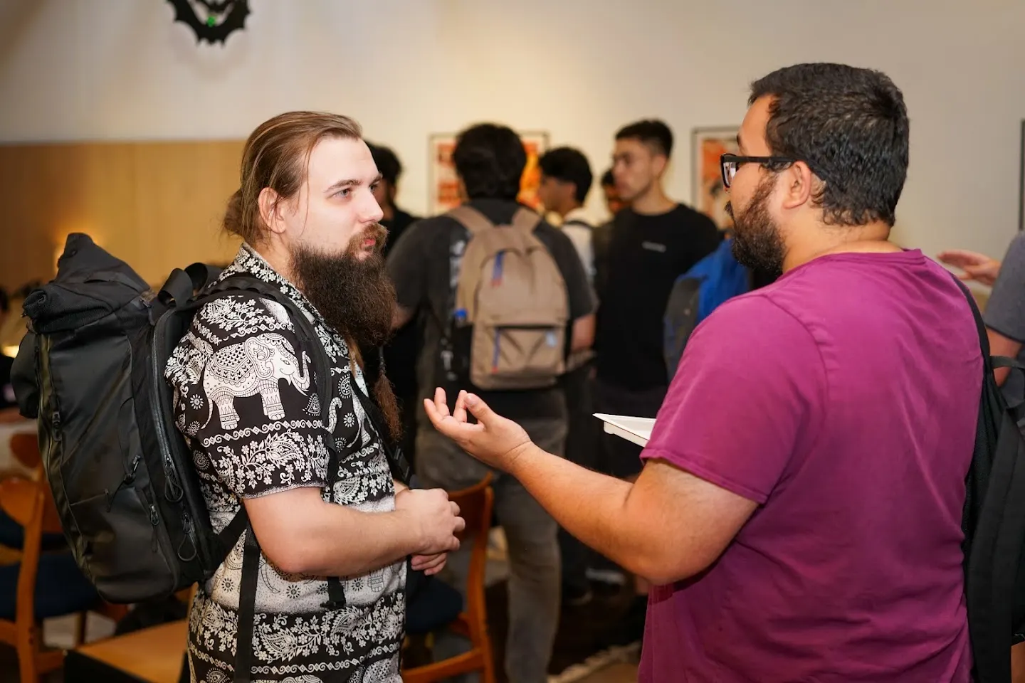 Attendees chatting and connecting at SF Tech Week 2026 w/ PostHog, Convex, & Elastic (photo 2)