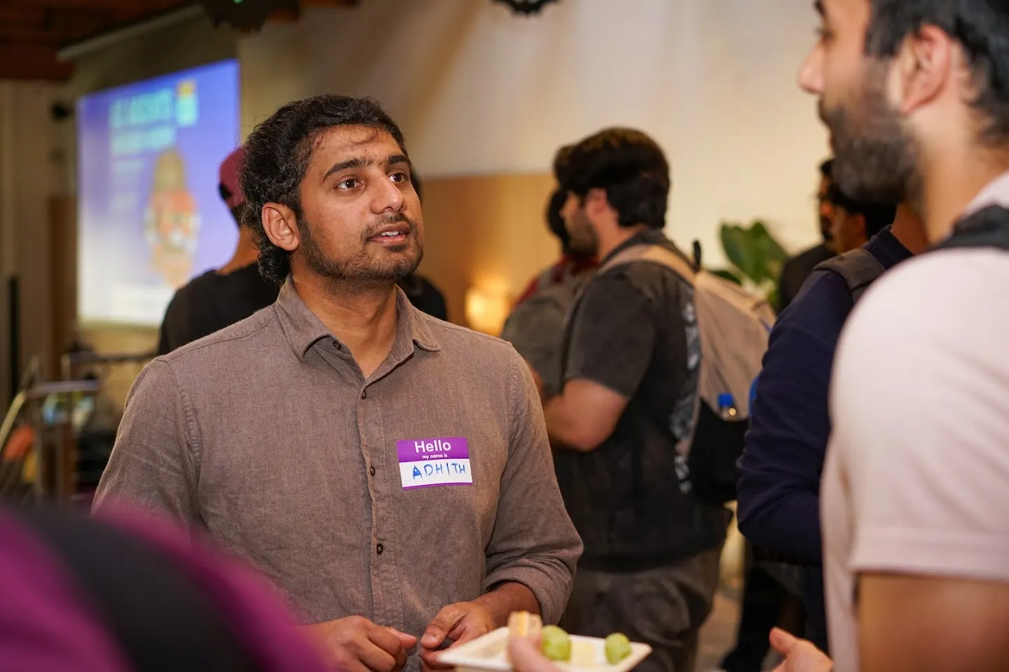 Attendees chatting and connecting at SF Tech Week 2026 w/ PostHog, Convex, & Elastic (photo 3)