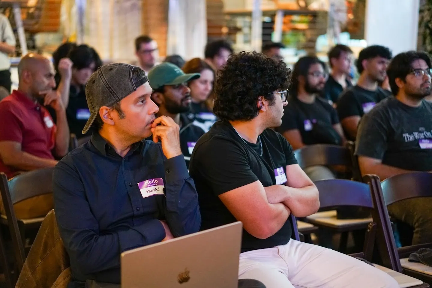 Panelists seated on sofas with microphones at AI Agents Builder Night