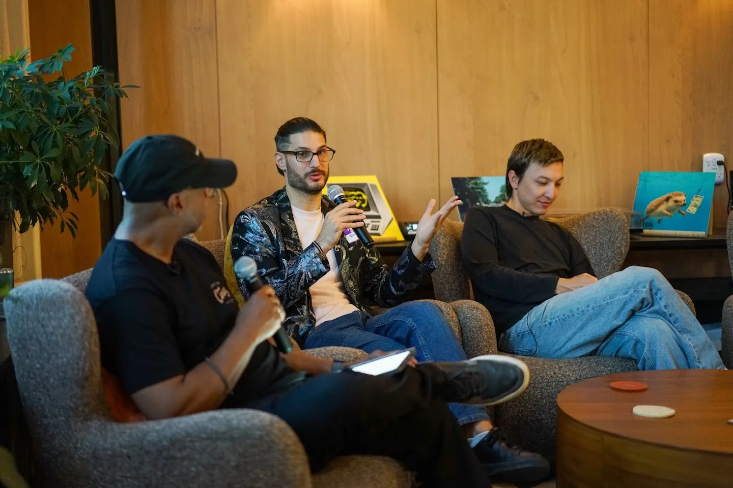 Panelists seated on sofas with microphones at AI Agents Builder Night