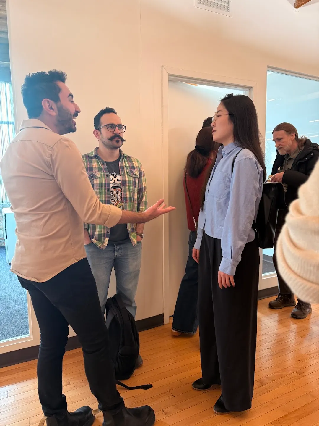 Attendees chatting and connecting at CNCF Toronto Meetup (photo 1)