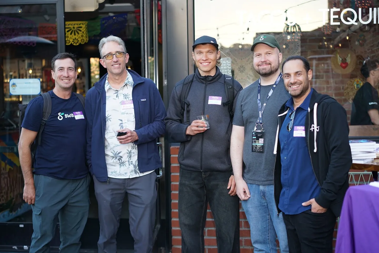 Guests gathered outside Barrio with drinks