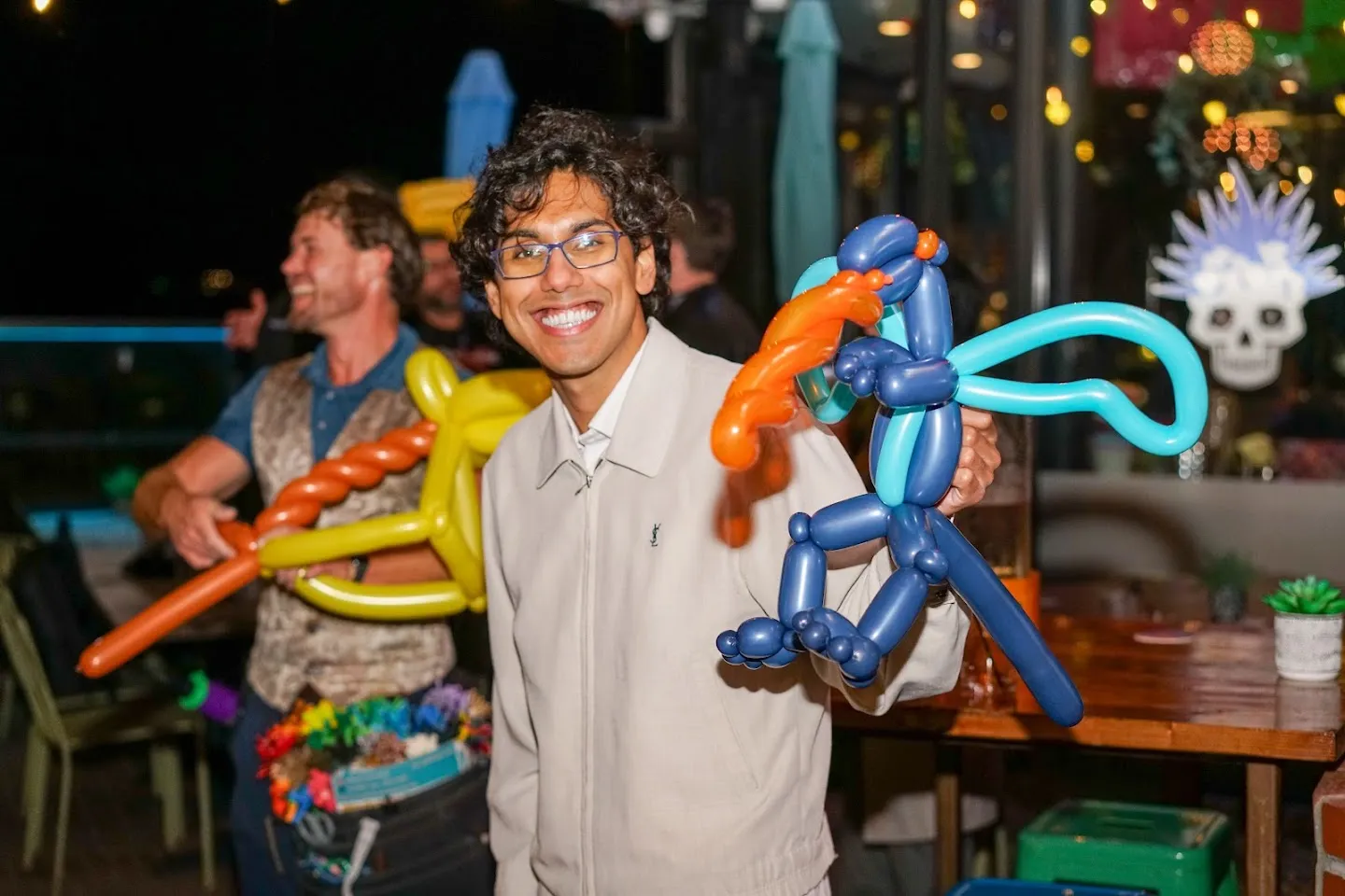 Guest surrounded by colorful balloon creations