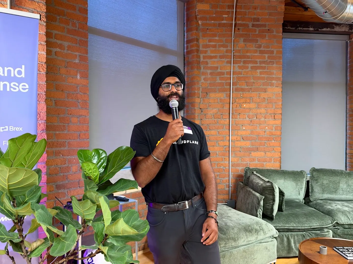 A speaker presenting to the community at Cloudflare x Rootly (photo 1)