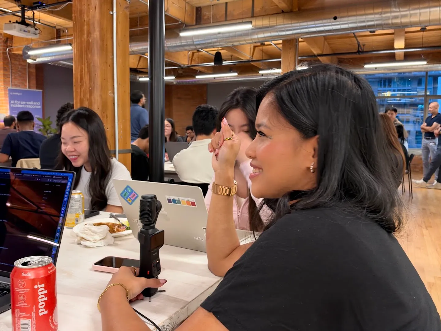 Attendees talking across a table at the AI agents workshop