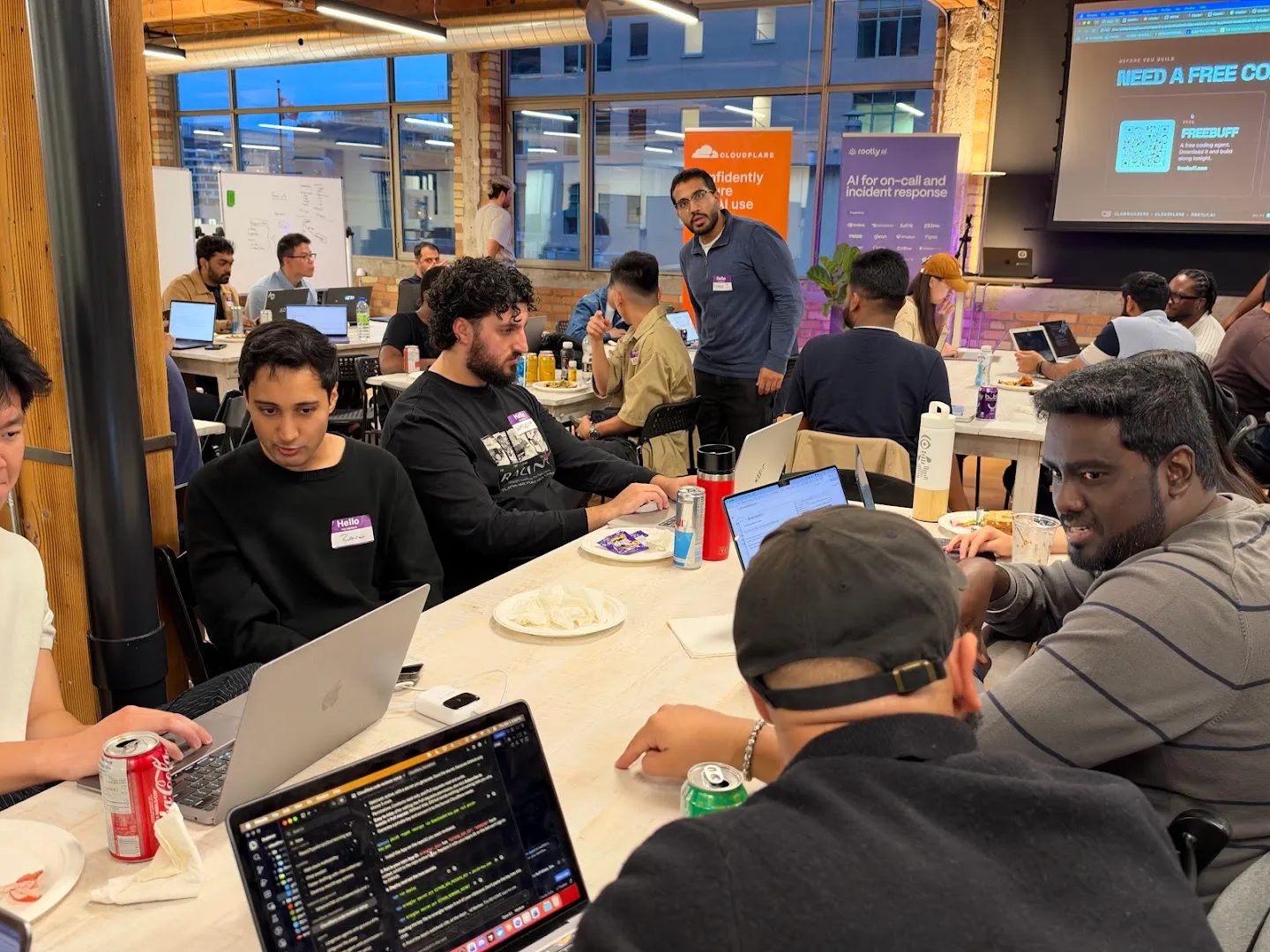 Attendees gathered around laptops for the AI agents workshop