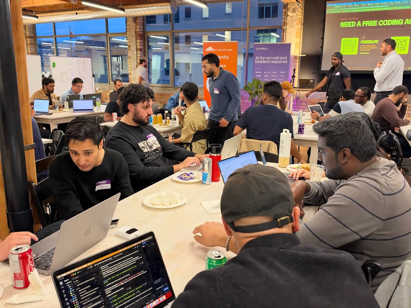 Attendees gathered around laptops for the AI agents workshop