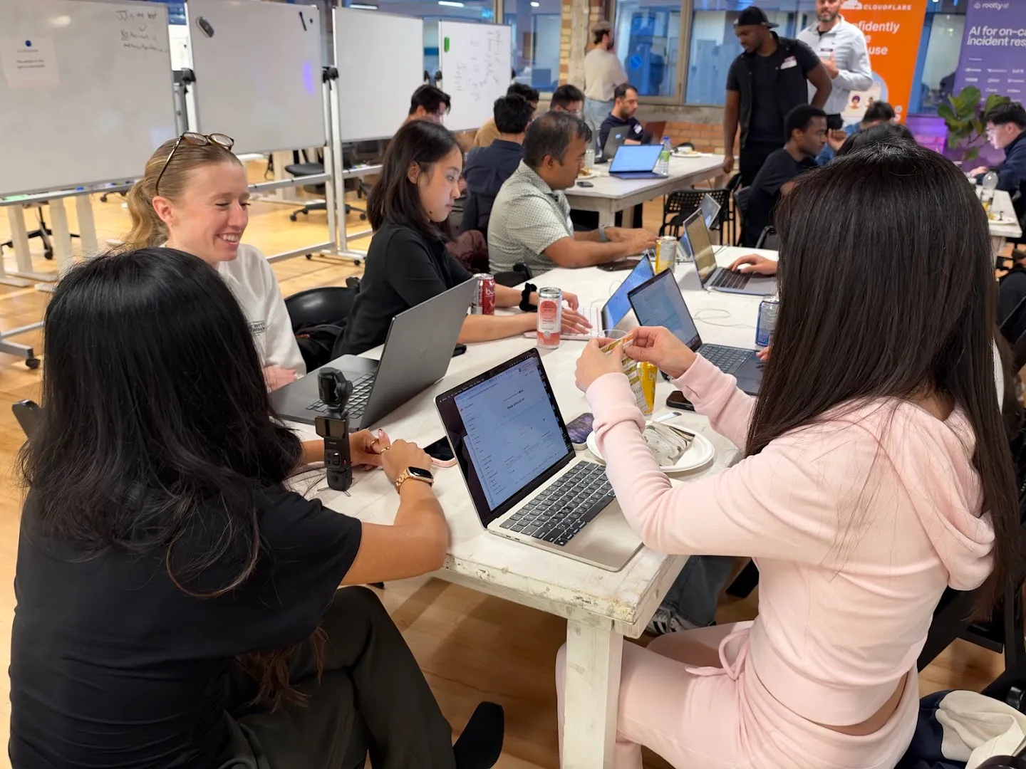 Attendees gathered around laptops for the AI agents workshop