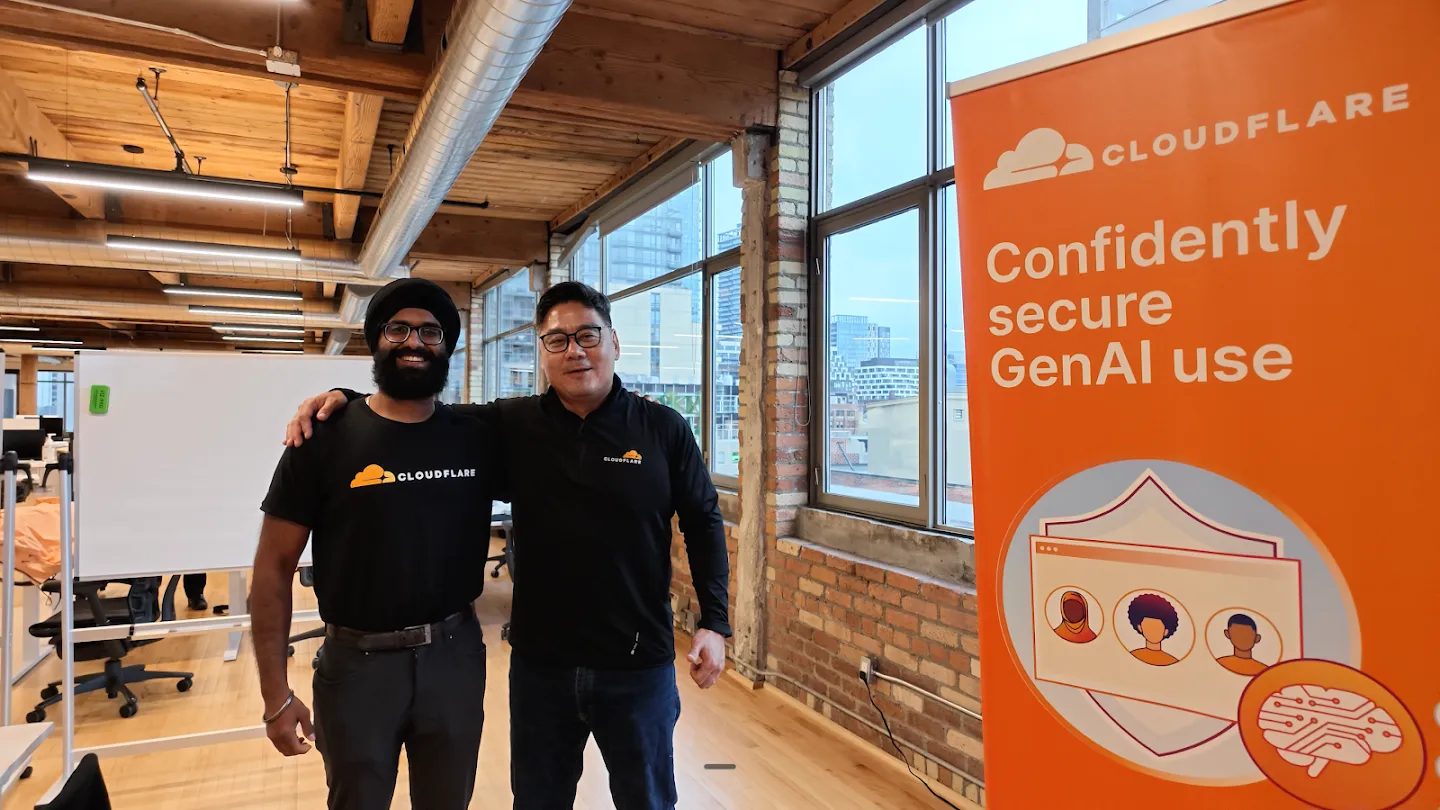 Hosts posing beside Cloudflare and Rootly banners