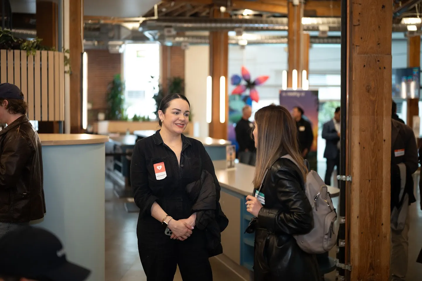 Attendees chatting and connecting at Rootly AI Labs @ GitHub SF (photo 1)