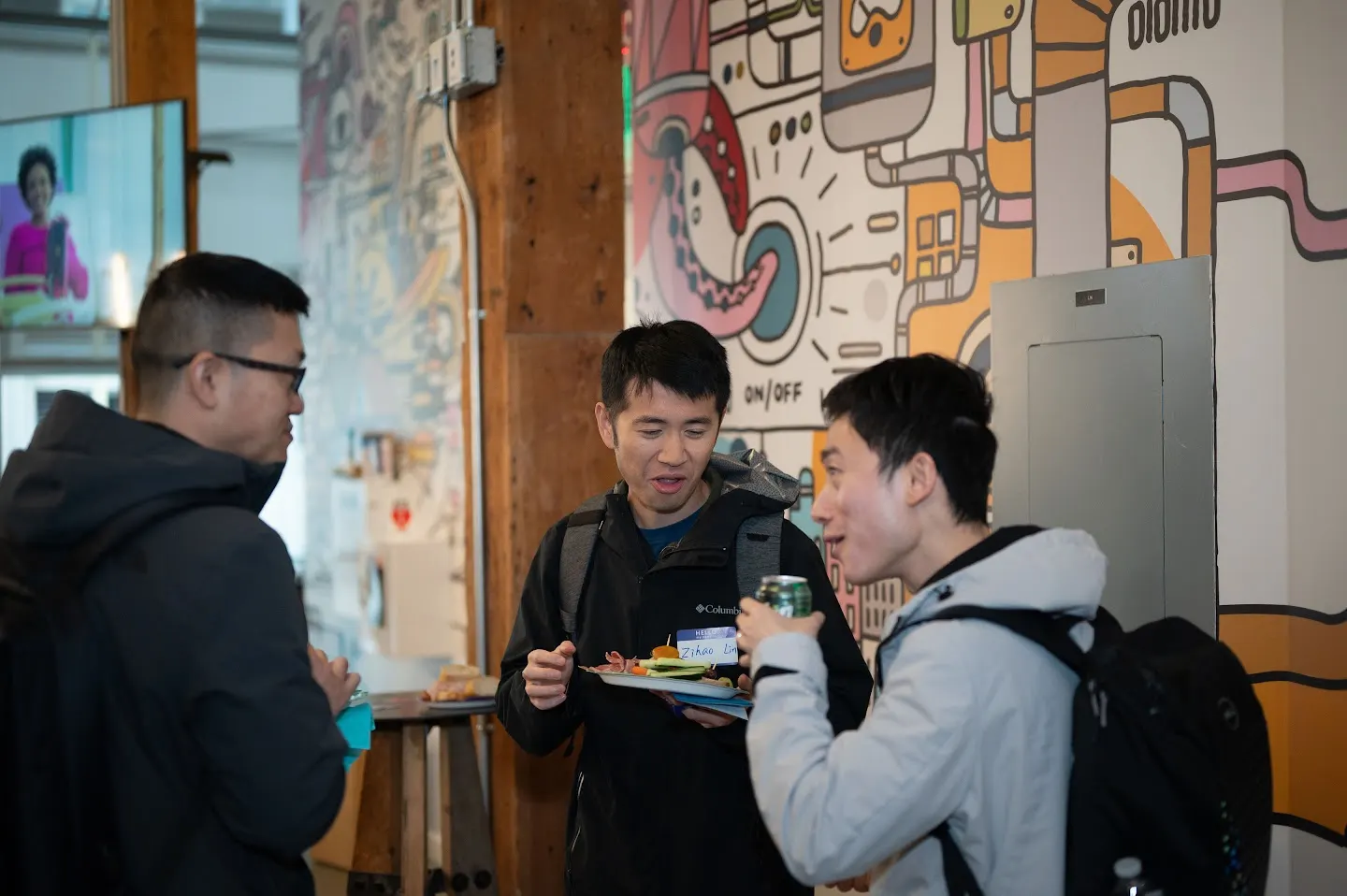 Attendees chatting and connecting at Rootly AI Labs @ GitHub SF (photo 3)