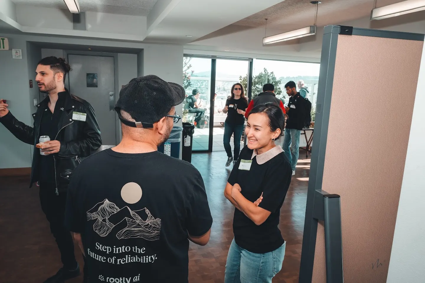 Attendees chatting and connecting at Rootly AI Meetup DevTools Demo Night (photo 3)