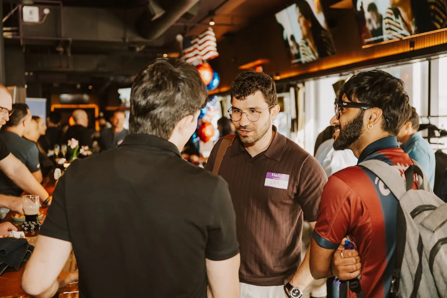 Attendees chatting and connecting at Rootly - AI Engineer World's Fair After Party w/ Inngest, Docker, Akido Security, and Tailscale (photo 4)