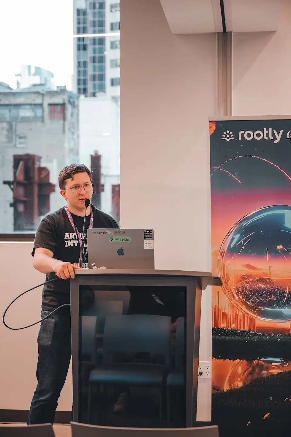 A speaker presenting to the community at Rootly AI Meetup @ AWS Builder Loft (photo 8)