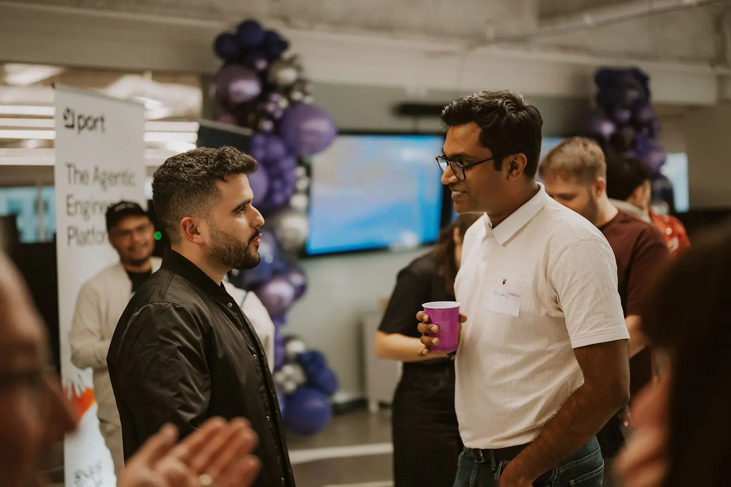 Attendees chatting and connecting at Rootly Meet Up (SF) - Running AI at Enterprise Scale (photo 8)