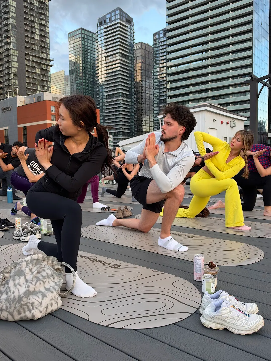 Participants practicing rooftop yoga at Rooftop yoga w Rootly x Chatbase (photo 2)