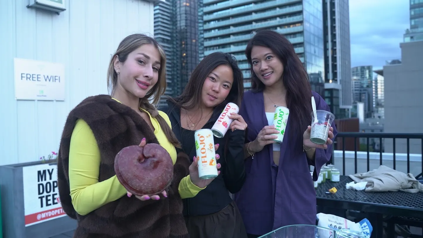 Community members posing together at Rooftop yoga w Rootly x Chatbase (photo 9)