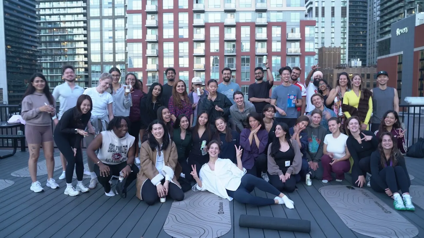 Community members posing together at Rooftop yoga w Rootly x Chatbase (photo 10)