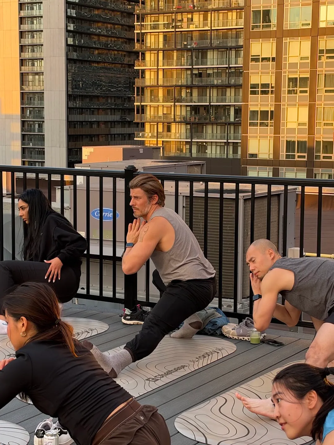 Participants seated on mats during rooftop yoga