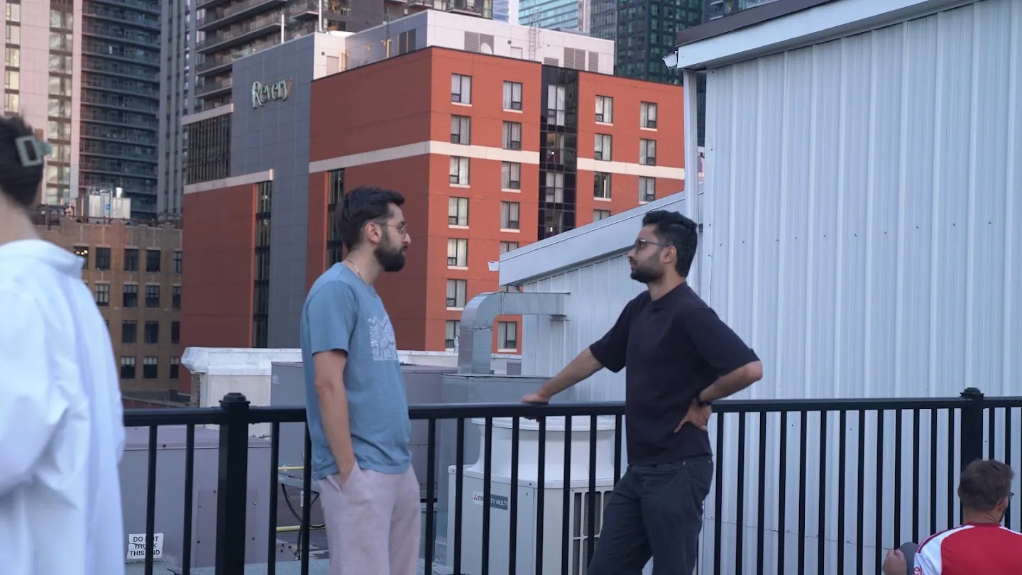 Guests talking on the rooftop after the yoga session