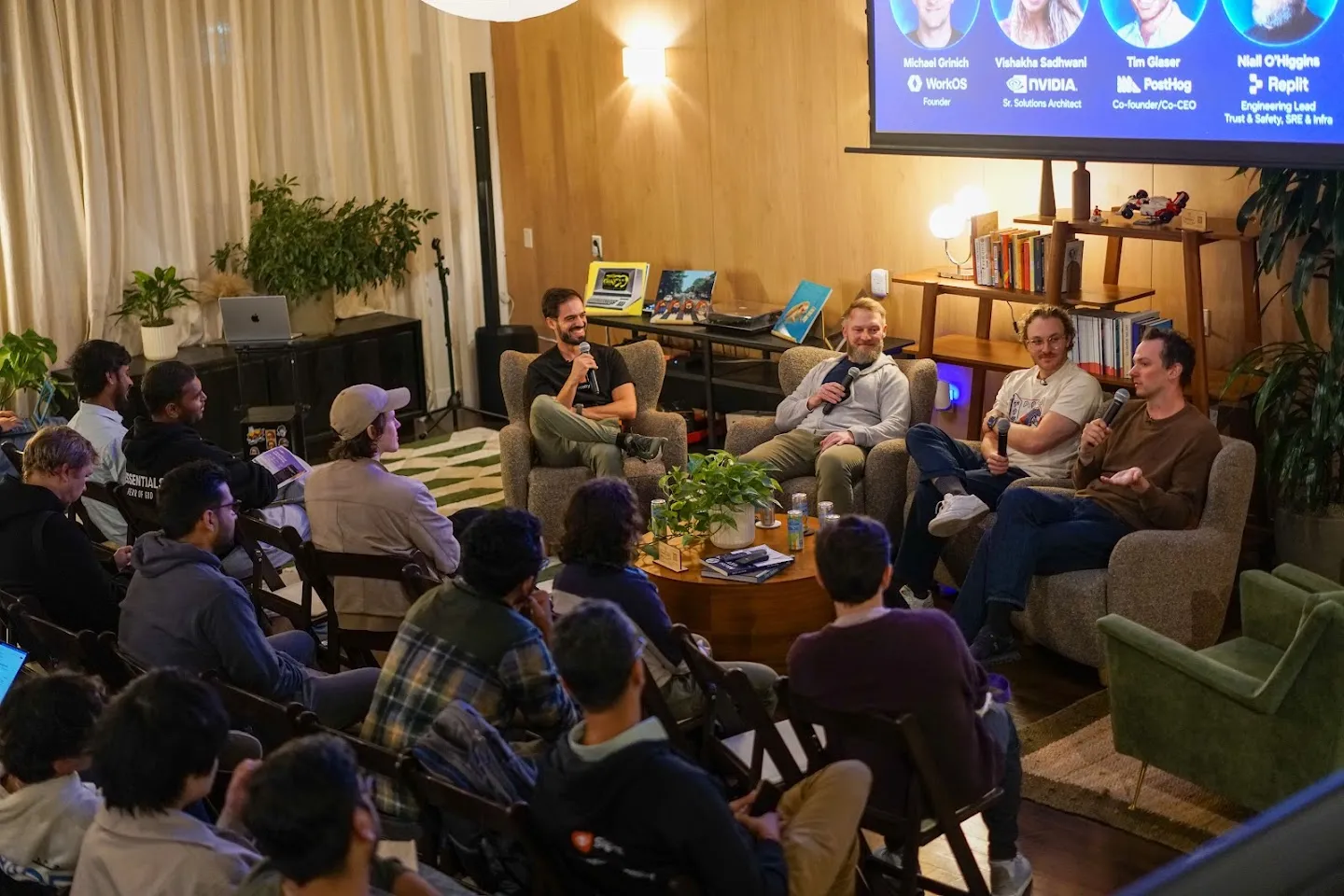 A wide view of the panel and seated audience
