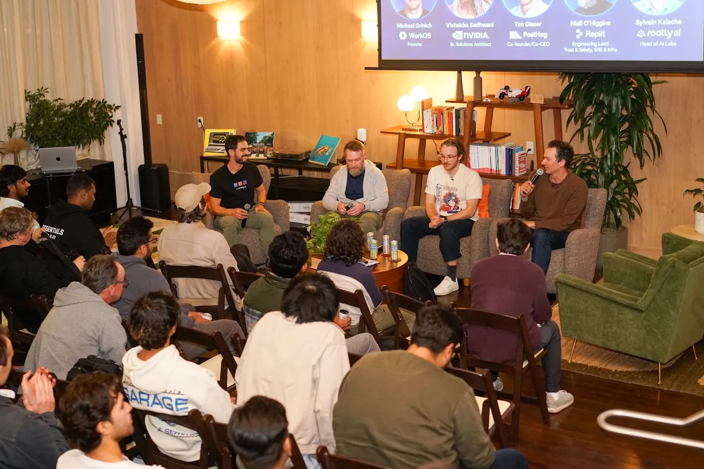 The panel discussing agents with the audience seated nearby