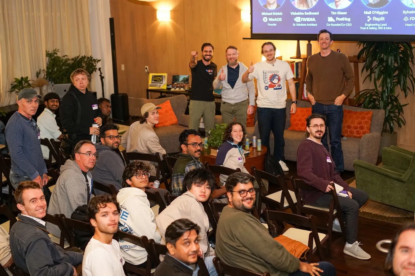 Speakers and attendees posing together after the discussion