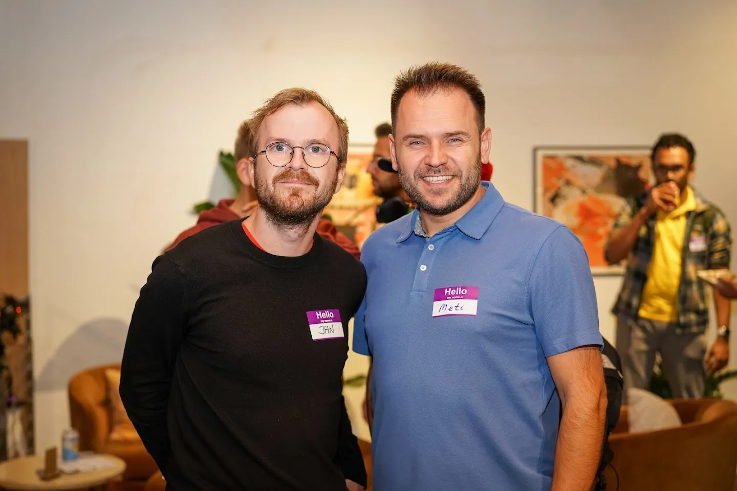 Two attendees posing together after the discussion