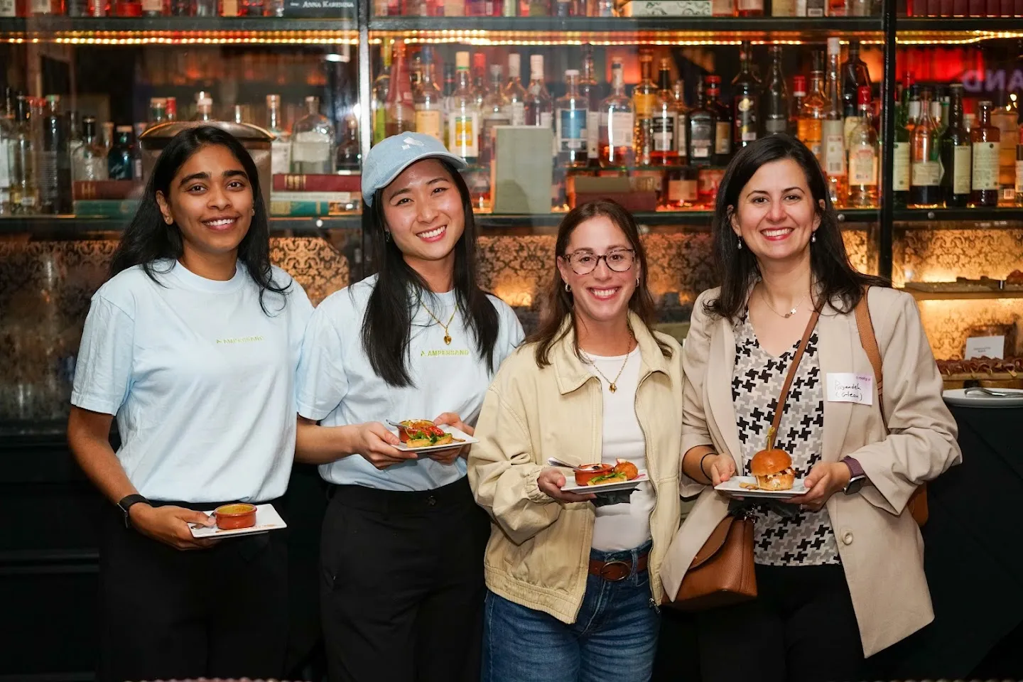 Guests posing together with drinks at Twilight in Novela