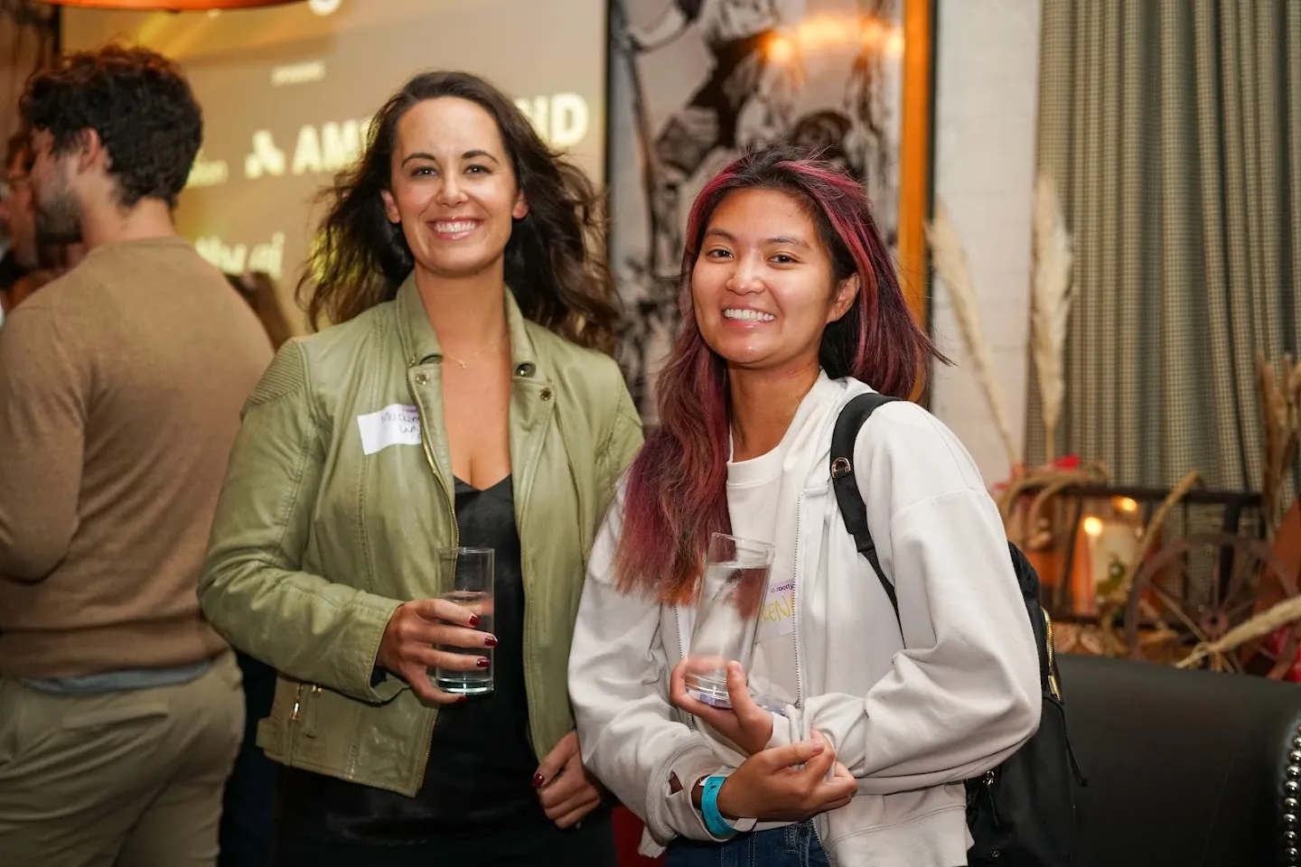 Guests posing together with drinks at Twilight in Novela