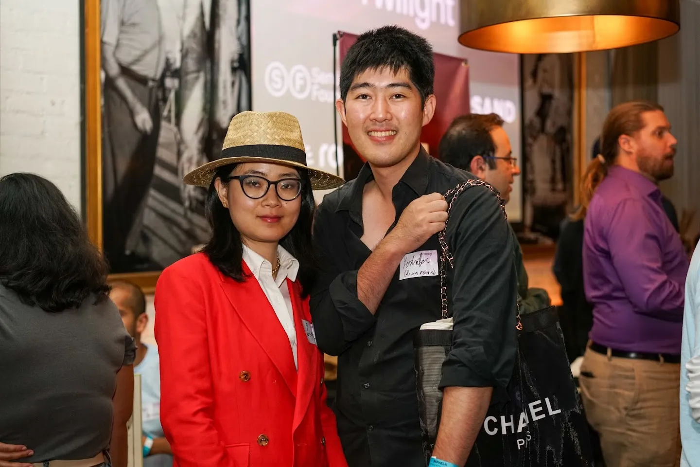 Guests posing together with drinks at Twilight in Novela