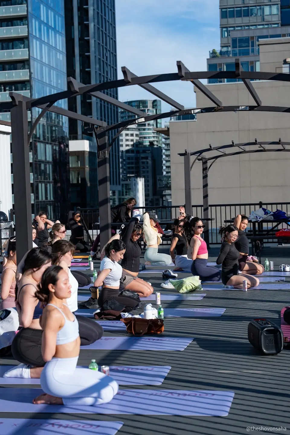 Participants practicing rooftop yoga at Rootly Yoga @ Toronto Tech Week (photo 4)